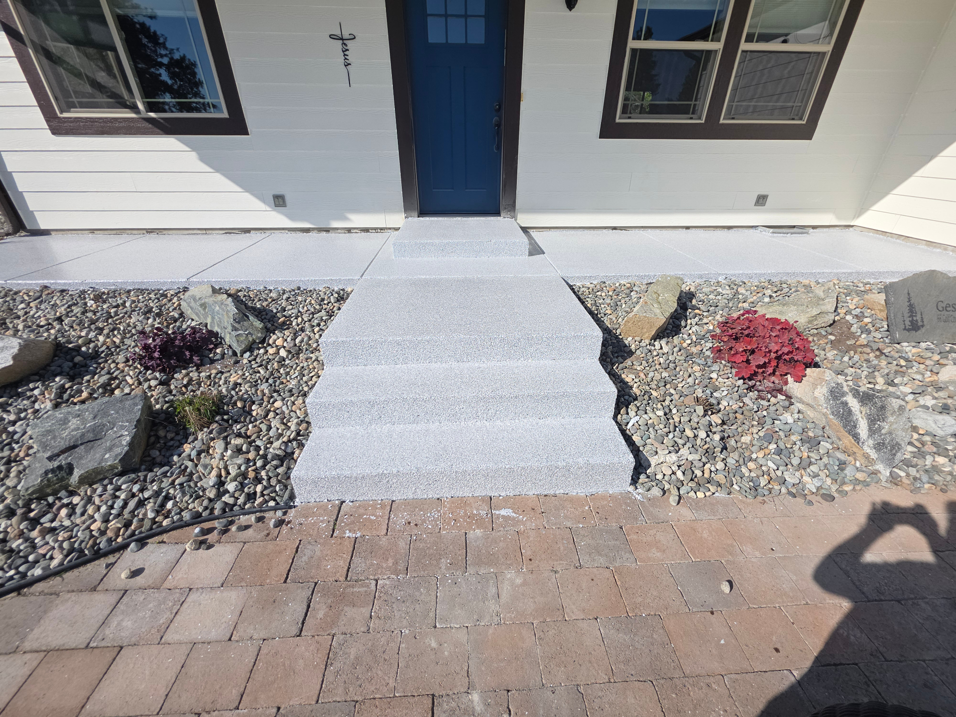 Textured concrete front steps and landing